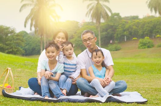 Outdoor portrait of asian family