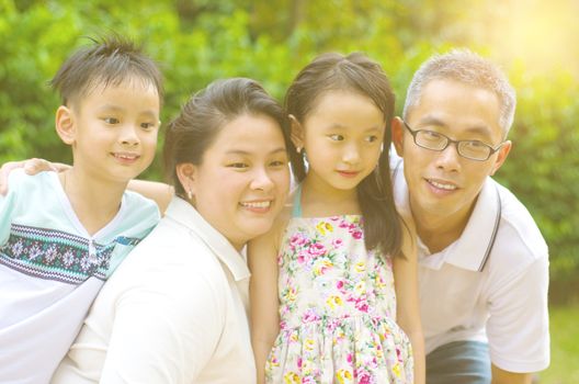 Outdoor portrait of asian family