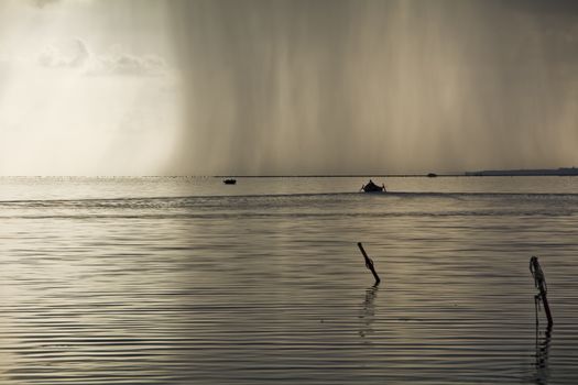 Sunset in the lagoon, where fishermen return to the approach of the impending storm. Dawning. Mediterranean islands.