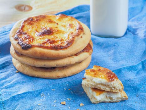 Traditional russian pasties Shanga - opened circle pie with cottage cheese. Close up view of carols cheesecake with cottage cheese.