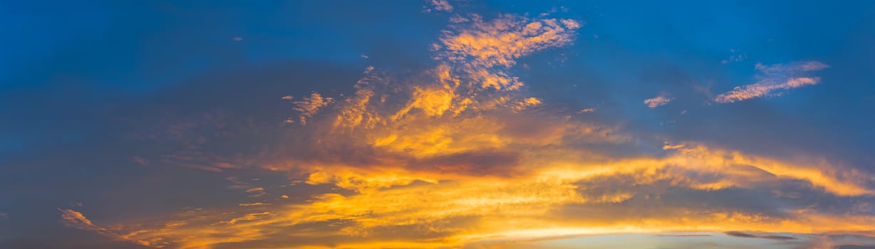 Sunset panorama in a beautiful summer morning in the blue sky