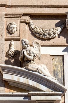 the statue of an angel praying