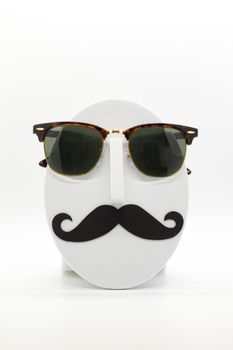 Men's fashion mannequin wearing fashionable sunglasses on white background.