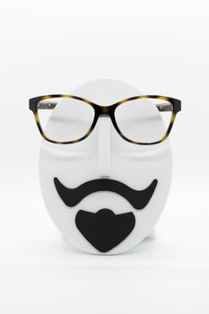 Men's fashion mannequin wearing fashionable spectacles on white background. Glasses