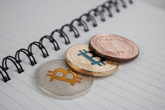 Cryptocurrency physical silver brass and gold bitcoin coins.