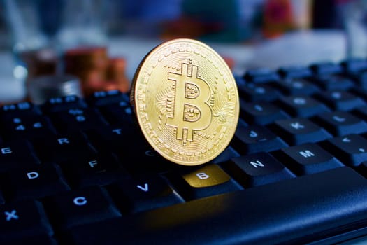 Big bitcoin coin on the keyboard