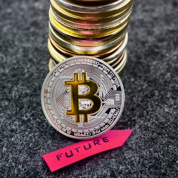 Cryptocurrency physical silver bitcoin coin and future pink arrow