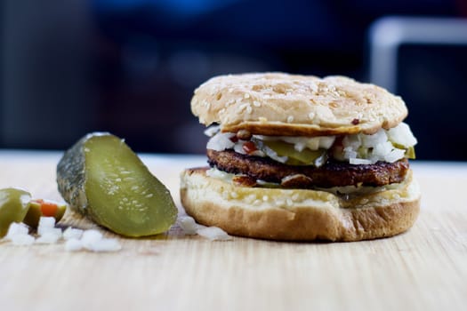 Veggie burger and pickled cucumber