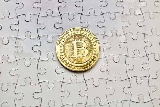Digital coin on the puzzle background