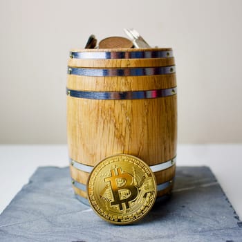 Gold bitcoin in barrel