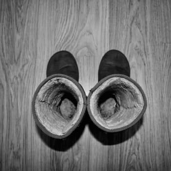 Old shoes on the wooden floor