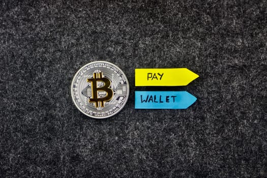 Digital currency silver bitcoin coin with arrows. Pay and wallet.