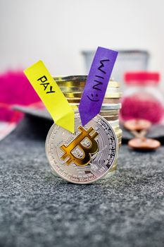 Digital currency physical silver bitcoin coin with colorful arrows.