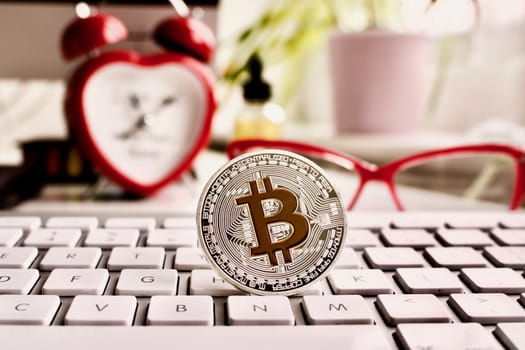 Cryptocurrency silver bitcoin coin with red clock