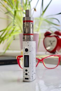 Old white and silver electronic vaporizer