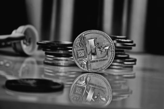 Cryptocurrency physical silver litecoin coin near money