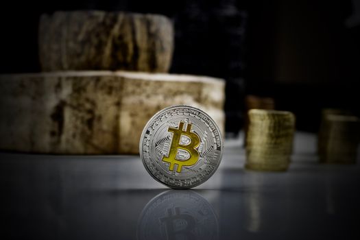Cryptocurrency physical silver bitcoin coin with yellow sign