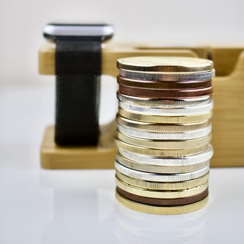 Brass, silver and gold coins on the table