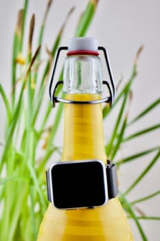 Black smartwatch on the diy bottle holder