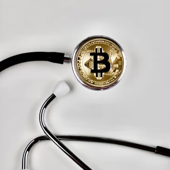Cryptocurrency physical gold bitcoin coin in medical concept