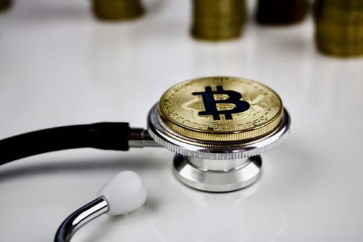 Cryptocurrency medical concept with a gold bitcoin coin