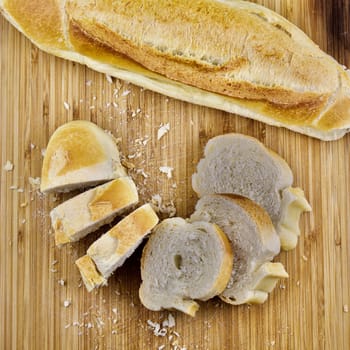 Fresh bread on wooden board in the kitchen