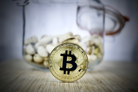 Digital currency gold bitcoin coin with black sign. Kitchen concept.