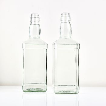 Two transparent bottles on the table