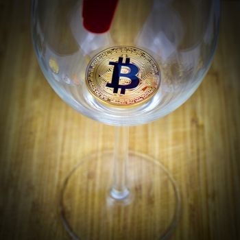 Cryptocurrency physical gold bitcoin in glass. Faucet.