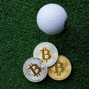 Digital currency physical bitcoin coins in golf club