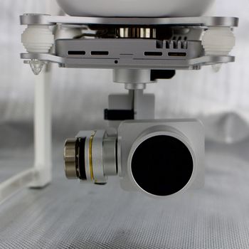 Flying aircraft video equipment. 4K 3 axis gimbal silver camera.