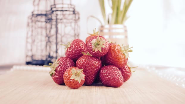 Fresh red strawberries on the wooden board