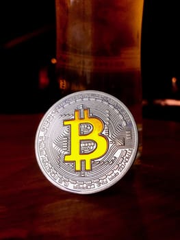 Cryptocurrency physical silver bitcoin coin with yellow sign