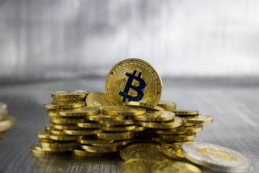 Cryptocurrency physical gold bitcoin coin near gold money.