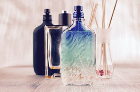 Green and blue fragrance bottle - perfume composition