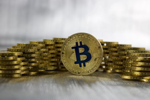 Digital currency physical gold bitcoin coin money concept.