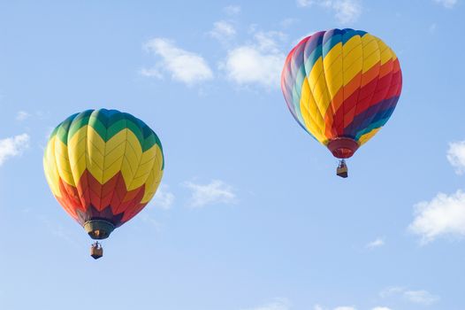 Two hot air balloons soaring in the air