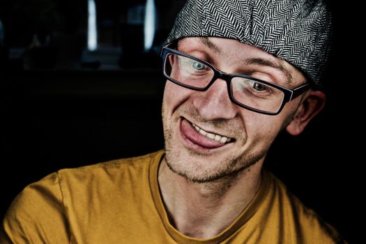 White young crazy man in grey cap and tshirt