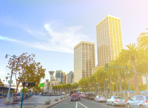 Rush hour with defocused cars- Traffic jam in San Francisco downtown - Blurred bokeh postcard of SanFrancisco with warm sunny day color tones - Real life transportation concept