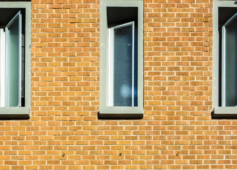 Windows on brick wall in a sunny day