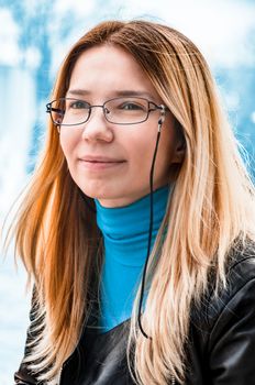 Portrait of a beautiful young woman in glasses.