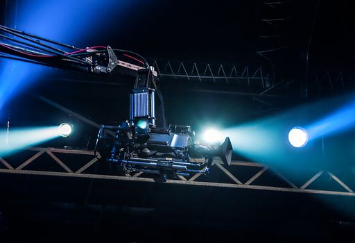 TV camera on crane on concert. TV camera