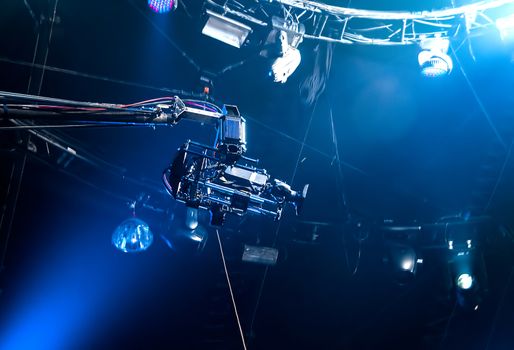 TV camera on crane on concert. TV camera