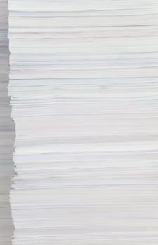 High stack of paper close-up as background