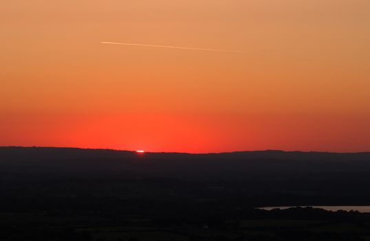 Sunrise in May, from Bo Peep Hill in East Sussex, with Arlington Reservoir.