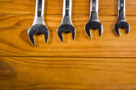 Set of wrench on a wooden background