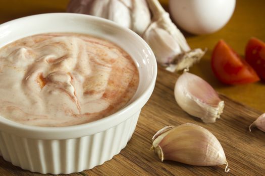 Garlic dip sauce with egg and fresh tomatoes
