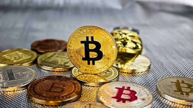 Digital currency physical gold bitcoin coin on the money.