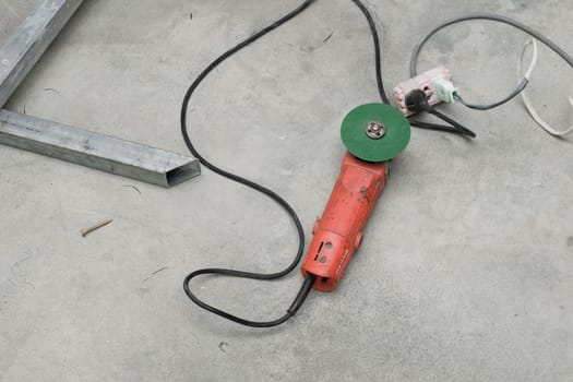 COLOR PHOTO OF PLUGGED ELECTRIC GREEN WHEEL GRINDER