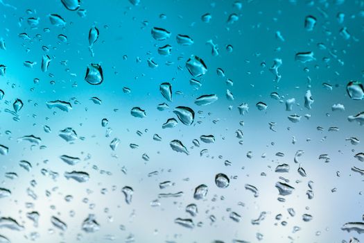 Closeup shot of water drops on the glass